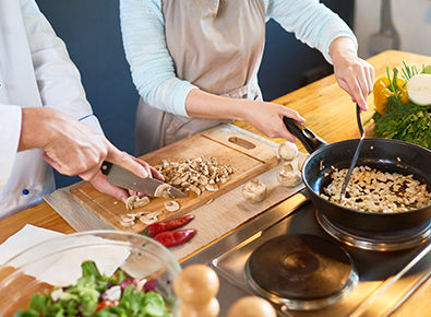 A photo of a couple cooking